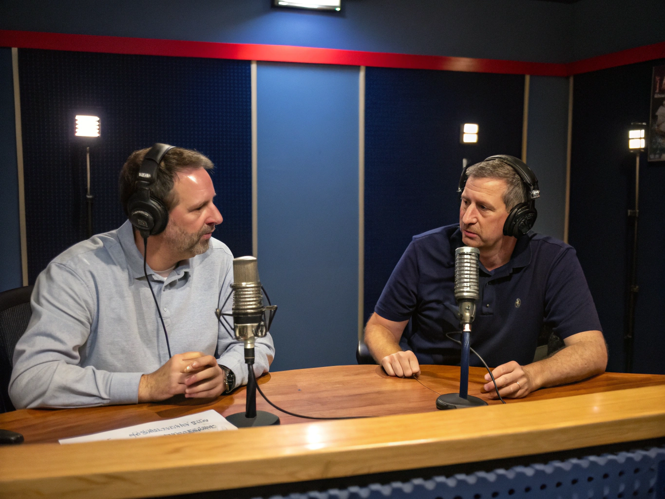 Candid photograph of medical podcast hosts in a professional studio